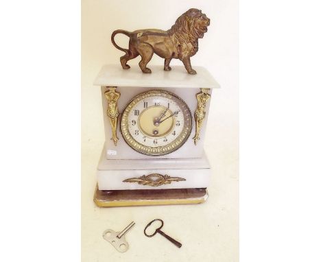 A 19th century alabaster mantel clock with lion and caryatid decoration