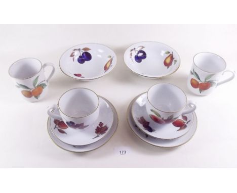 A Royal Worcester Evesham dinner service comprising: eight dinner plates, eight side plates, seven tea plates, seven fruit pl
