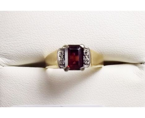 A 15 carat gold garnet and diamond ring, size 0