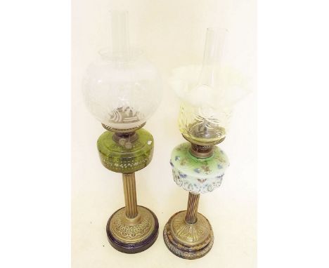 A Victorian green glass floral oil lamp with vaseline glass shade and another oil lamp with etched shade a/f on brass base