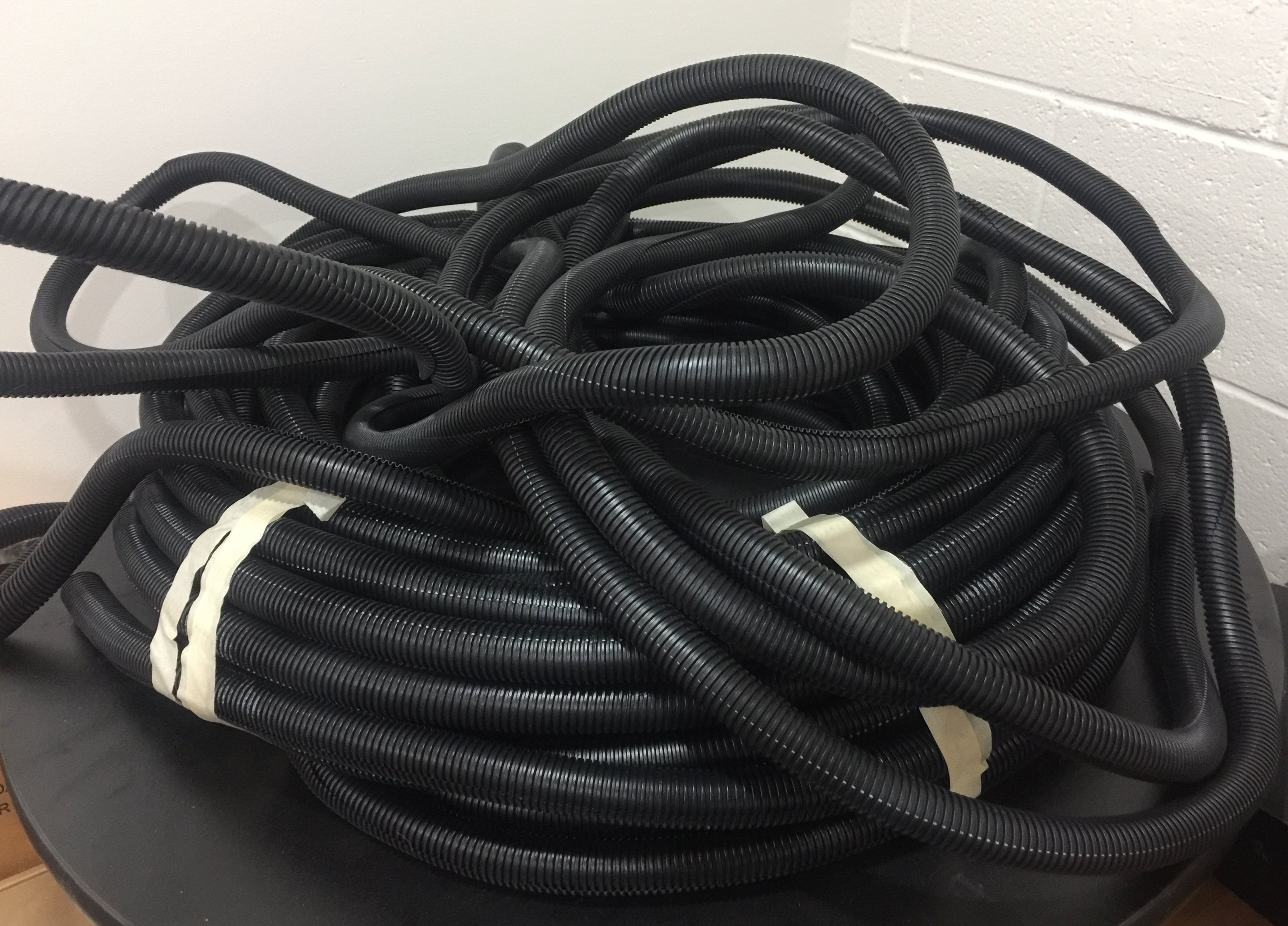 LARGE LOT WIRE PLASTIC COVERING TUBE THIS TUBBING GOES OVER WIRES TO
