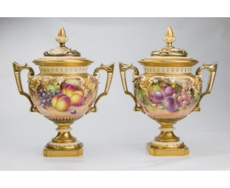 A pair of early 1970s Royal Worcester fruit painted pot pourri and covers, each with sceptre finial, twin key handles, gadroo