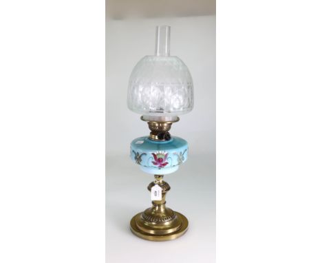 An Edwardian paraffin lamp, having clear chimney, frosted and clear domed shade, turquoise, florally painted glass reservoir 