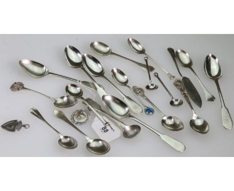 A part set of five Georgian silver fiddle pattern teaspoons, a silver teaspoon with enamel terminal, a silver mustard spoon, 
