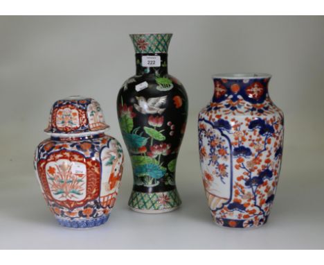 A 19th century Japanese Imari covered jar, of lobed baluster form, decorated with reserves of figures, flowers and rushes, an