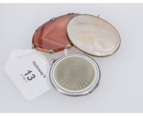 An Edwardian guilloche enamel locket, together with a mother of pearl cameo brooch and a banded agate brooch