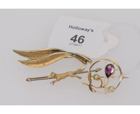 An Edwardian amethyst and peridot foliate spring circle brooch, together with a fox bar brooch and a leaf brooch
