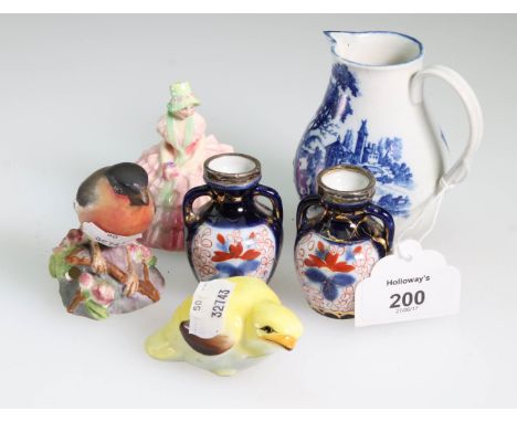 An 18th century Worcester sparrow beak jug, of loop handled baluster form, transfer decorated with village and landscapes, 9.