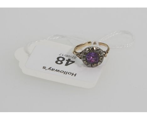 A 19th century amethyst and diamond cluster ring, the cushion-shaped amethyst within a border of rose-cut diamonds, close bac
