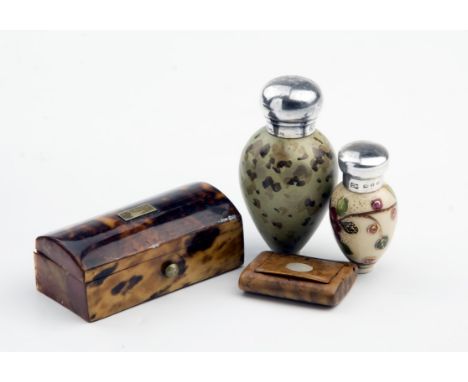 GS, FS, a silver capped scent bottle, fashioned as a blackbird's egg, Birmingham marks, another similar smaller scent bottle,