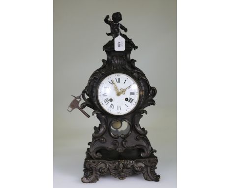 Roblin, Paris, a late 19th century spelter mantel clock, the rococo case with putto finial enclosing an 8-day bell striking m