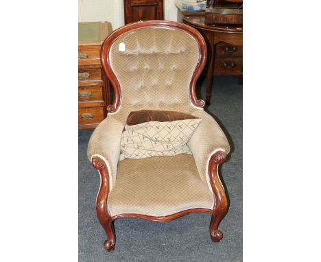 A mid 19th century Victorian mahogany framed spoon back drawing chair, with button back patterned velvet upholstery and stuff