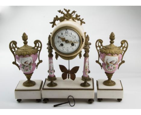 A 19th century French clock garniture, the drum case enclosing 8-day bell striking movement faced by florally painted enamel 