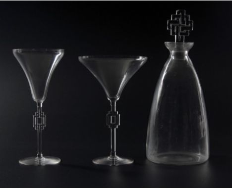 An early 20th century Lalique 'Haguenau' pattern part table suite of glassware, comprising two flared rim champagne pedestals