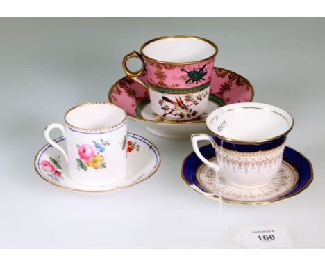 A Spode (2527) bone china coffee cup and saucer, moulded and painted with cut blooms, together with other decorative coffee c