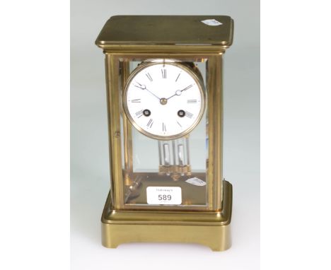 A late 19th century French brass cased four glass mantel clock, the Japy bell striking movement with mercury pendulum faced b