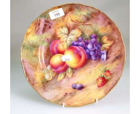 A Royal Worcester fruit painted 27cm diameter plate, decorated with peaches, grapes and strawberries against a mossy bank, si