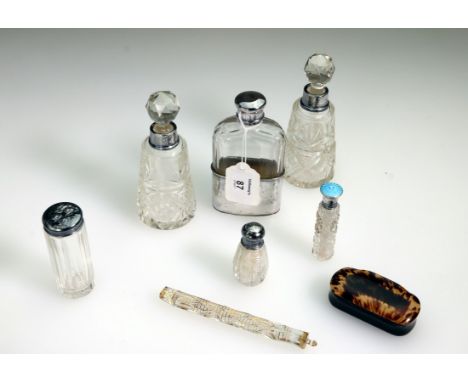 A pair of Edwardian cut glass dressing table scent bottles and stoppers, each with silver collar, London 1924, a cut glass La