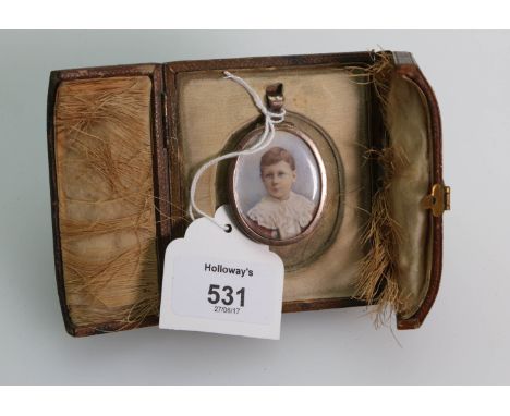A silver gilt portrait miniature, head and shoulders of a young boy wearing a lace collar, 4 x 3cm, London 1900