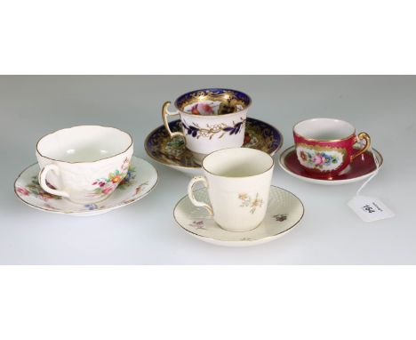 A mid 19th century Coalport tea cup and saucer, decorated with floral springs and gilded leaves, together with a Chamberlain'