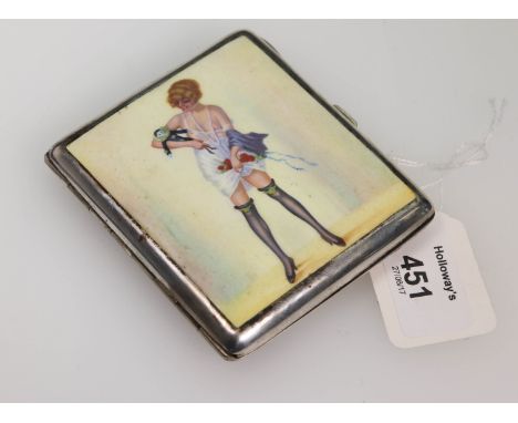 An early white metal cigarette case, the hinged cover enamel decorated with a scantily clad young woman holding a pierrot dol