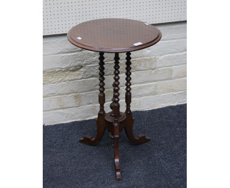 An Edwardian mahogany occasional table, circular top on three bobbin turned supports with central boss on three swept and blo