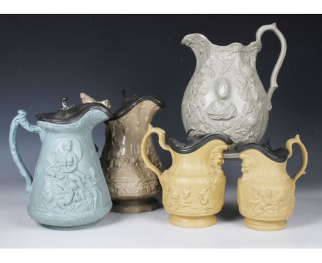 Fifteen assorted relief moulded stoneware jugs, 19th century, in varying colours, some with pewter tappit lids, including a M