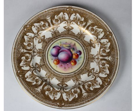 A Royal Worcester cabinet plate, circa 1970, painted by F. Higgins, signed, with a central panel of fruit within a wide acid 