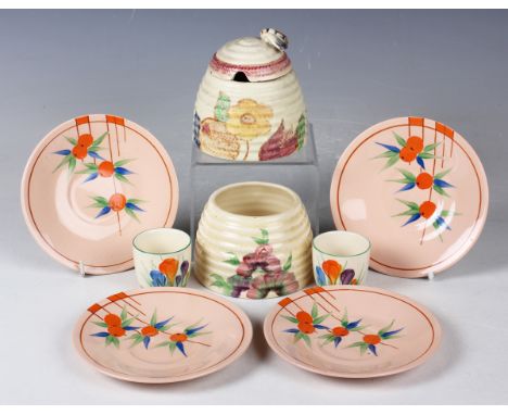 A small group of Clarice Cliff pattern wares, 1930s/1940s, comprising four Damask Rose Fruit saucers, diameter 12.7cm, two Au