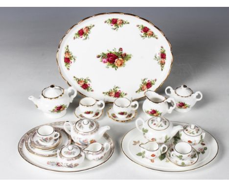 A Royal Albert Old Country Roses pattern miniature tea-for-two, comprising oval tray, length 22.5cm, teapot and cover, sucrie