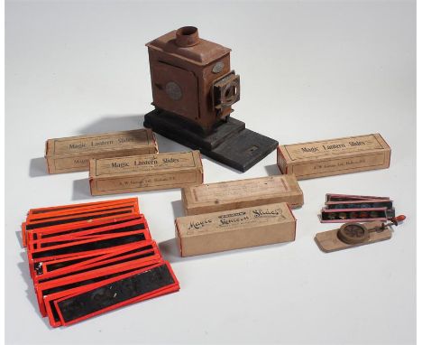 Magic lantern slide and projector, Standard E.P. together with glass slides, some boxed