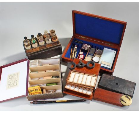 Mixed scientific objects, to include sample bottles, a stand, a rotating slide stand, a microscope slide box, microscope slid