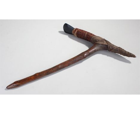 Papua New Guinea axe, Sepik river, the greenish volcanic stone head bound into the wood axe, pointed wooden haft, 50cm long