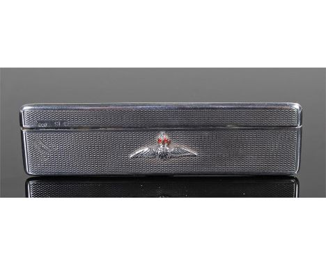 RAF interest, hallmarked Birmingham 1940, the engine turned silver case with RAF badge, M engraved to the edge, 10.5cm wide