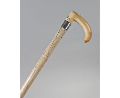 Late 19th Century whalebone walking stick, the curved top above a white metal collar engraved 'Presented to W.Smith, C.T.' ab