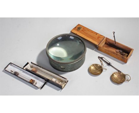 Apothecary scales, with brass pans and steel arm, together with a lens and two glass syringes, (4)