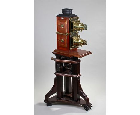 Impressive early 20th Century Lizars dual lens magic lantern slide projector, the brass lens with mahogany case, twin hinged 