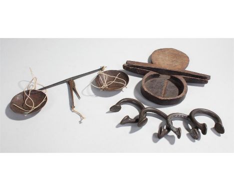 19th Century set of apothecary scales, the brass pans with steel arm housed within a carved case, together with four manillas