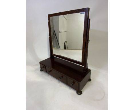 A mahogany dressing table mirror with three drawers. W:57cm x D:22cm x H:64cm