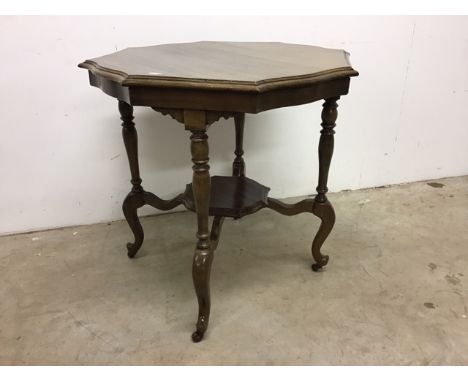 A mahogany hexagonal occasional table on original ceramic castors. W:72cm x D:72cm x H:72cm
