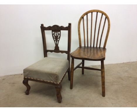 An oak stick back chair and an upholstered nursing chair. 