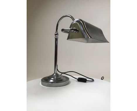 A chrome desk lamp in the Art Deco style. Maximum height 57cm.
