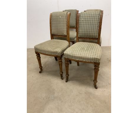 A Maple and Co set of four dining chairs, pitched pine with upholstered seat. Stamped Maple and Co with ceramic castorsW:46cm