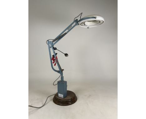A P.W. Allen &amp; Co industrial bench magnifier on a oak base. H:89cm