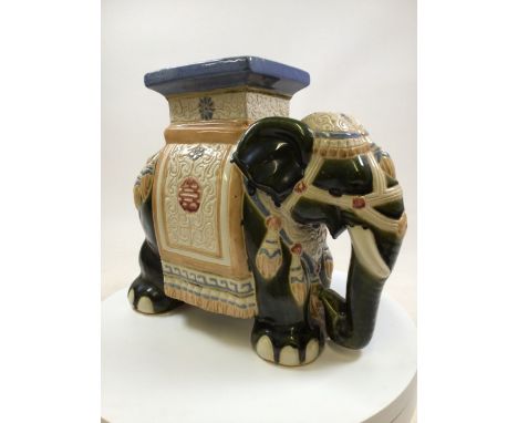 A large ceramic elephant conservatory seat  Stamped BHI to foot. W:50cm x D:18cm x H:43cm