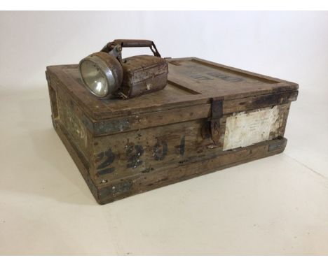 A Devon county library storage crate with vintage torch. 