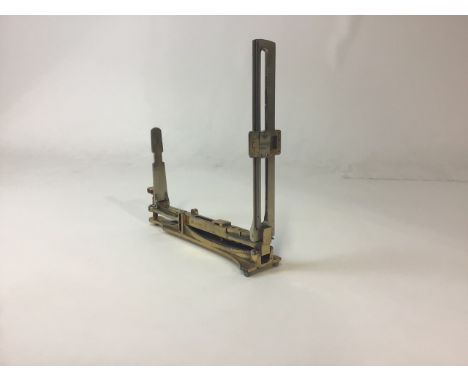 An early 20th century military brass rangefinder sight. Marked with broad head arrow and stamped UIC B7662. 24cm(l) 