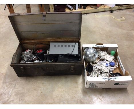 A collection of disco lighting in a metal trunk.