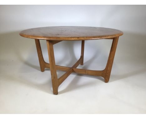 An Ercol style mid century circular light oak coffee tableW:90cm x D:90cm x H:48cm