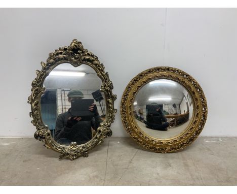 An oval and circular convex mirror with gilt frames.